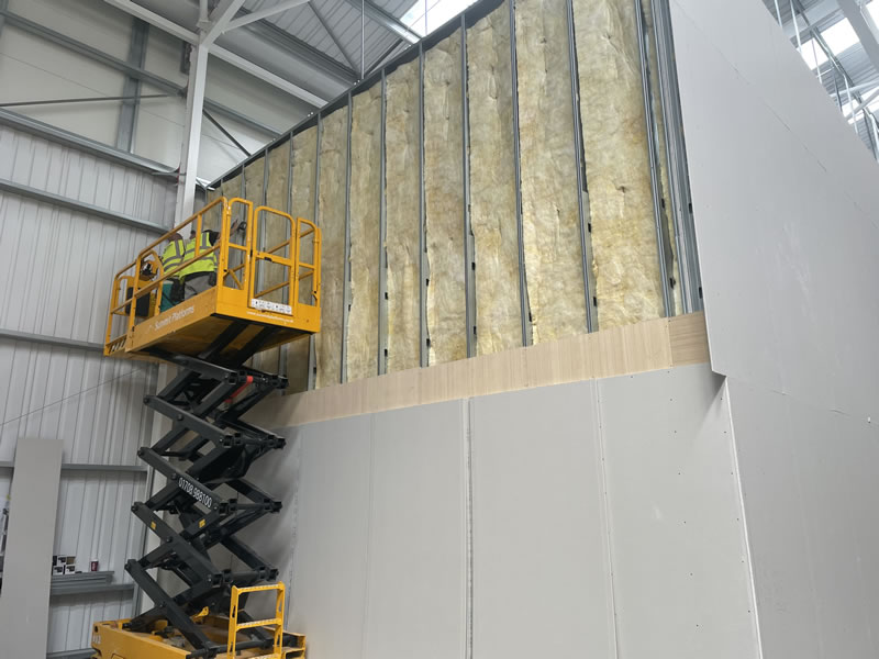 Acoustic sound proofing installed to solid wall partition